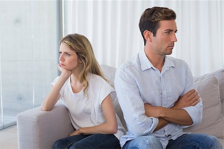 simsearch:400-07343634,k - Unhappy couple not talking after an argument in living room at home Stock Photo - Budget Royalty-Free & Subscription, Code: 400-07343266