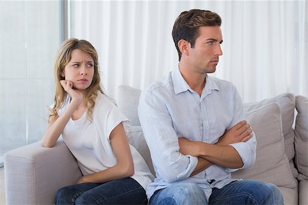 simsearch:400-07343634,k - Unhappy couple not talking after an argument in living room at home Stock Photo - Budget Royalty-Free & Subscription, Code: 400-07343274