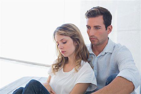 simsearch:400-07343634,k - Unhappy couple not talking after an argument in living room at home Stock Photo - Budget Royalty-Free & Subscription, Code: 400-07343434