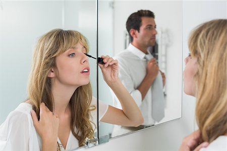 simsearch:400-07343634,k - Close-up of a beautiful young woman applying mascara in the bathroom at home Stock Photo - Budget Royalty-Free & Subscription, Code: 400-07343492