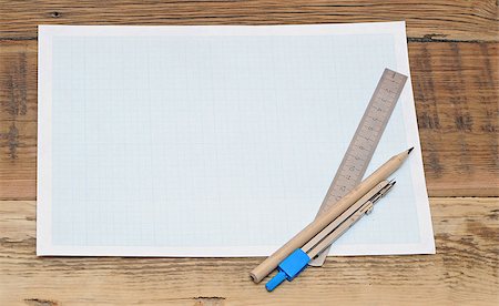 simsearch:400-04424177,k - Still life photo of engineering graph paper with pencil, compass and metal ruler blank to add your own design Stock Photo - Budget Royalty-Free & Subscription, Code: 400-07409717