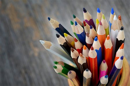 pencil crayon - Colorful pencils in ceramic boot on wood background Foto de stock - Super Valor sin royalties y Suscripción, Código: 400-07415280
