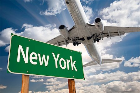 New York Green Road Sign and Airplane Above with Dramatic Blue Sky and Clouds. Stock Photo - Budget Royalty-Free & Subscription, Code: 400-07419106