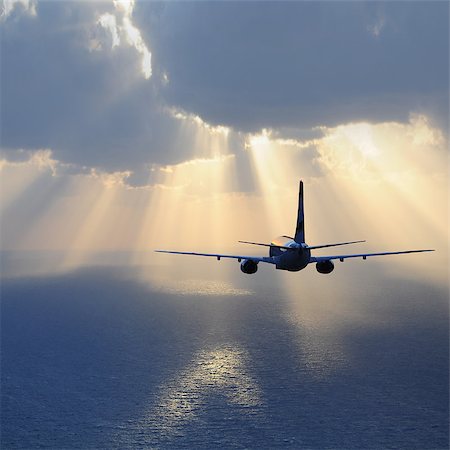 shadow plane - Passenger plane flies above the ocean. Stock Photo - Budget Royalty-Free & Subscription, Code: 400-07411084