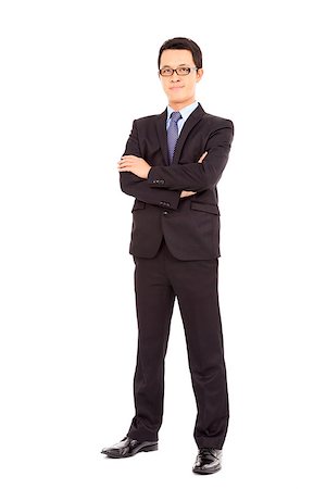Confident businessman standing arms crossed Stock Photo - Budget Royalty-Free & Subscription, Code: 400-07412795
