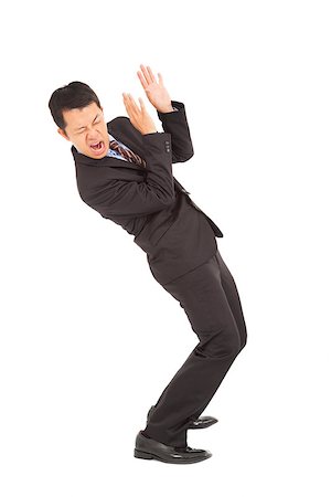 businessman scared  expression and bend down Stock Photo - Budget Royalty-Free & Subscription, Code: 400-07412813