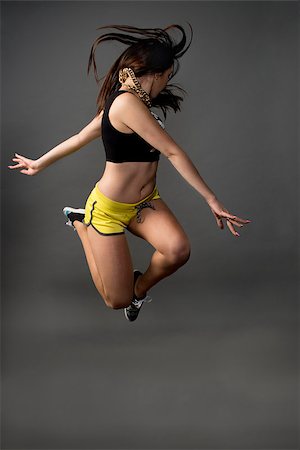 Fitness active girl jump over grunge background Stock Photo - Budget Royalty-Free & Subscription, Code: 400-07413761