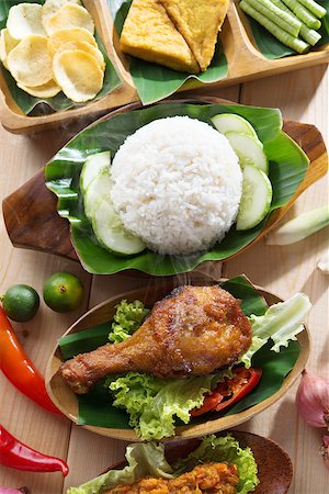 simsearch:400-07418409,k - Popular Indonesian local food nasi ayam penyet, indonesian fried chicken rice. Fresh hot with steam smoke. Stock Photo - Budget Royalty-Free & Subscription, Code: 400-07424742