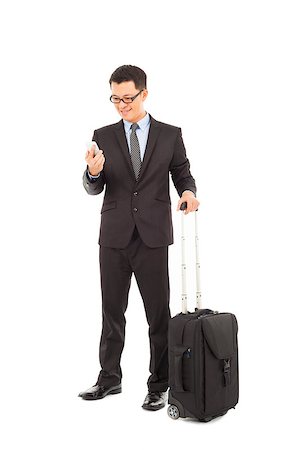 Young businessman holding a cell phone  with briefcase Stock Photo - Budget Royalty-Free & Subscription, Code: 400-07425919