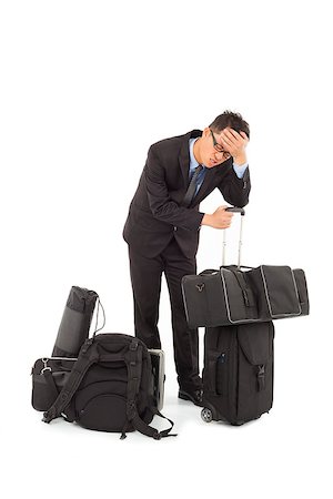 exhausted businessman is too tired to feel headache Stock Photo - Budget Royalty-Free & Subscription, Code: 400-07425924