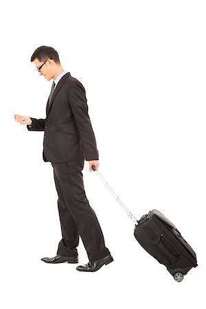 businessman walking and using phone  with briefcase Stock Photo - Budget Royalty-Free & Subscription, Code: 400-07425921