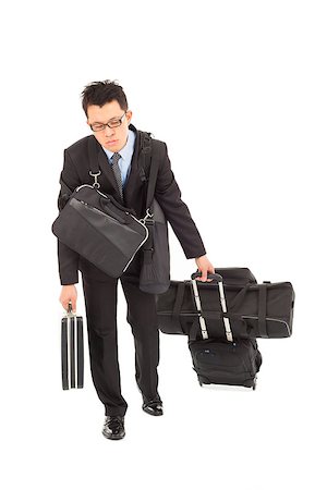 exhausted businessman taking all bags and suitcases Stock Photo - Budget Royalty-Free & Subscription, Code: 400-07425923