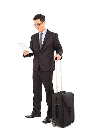 Young businessman holding a tablet  with briefcase Stock Photo - Budget Royalty-Free & Subscription, Code: 400-07425958