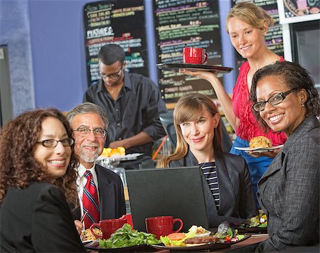 simsearch:400-04099373,k - Happy group of people with laptop in cafe and barista Stock Photo - Budget Royalty-Free & Subscription, Code: 400-07426176