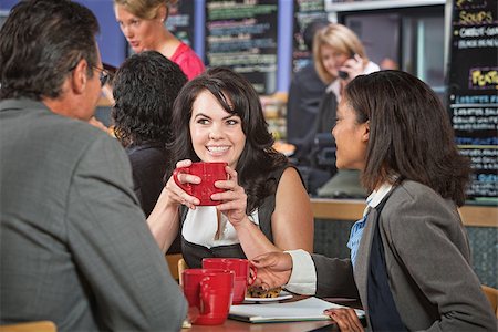 simsearch:400-04099373,k - Attractive woman and coworkers with coffee cups in restaurant Stock Photo - Budget Royalty-Free & Subscription, Code: 400-07426171