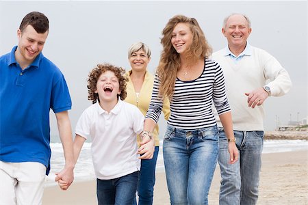 simsearch:400-07426233,k - Happy family having fun on the beach Stock Photo - Budget Royalty-Free & Subscription, Code: 400-07426224