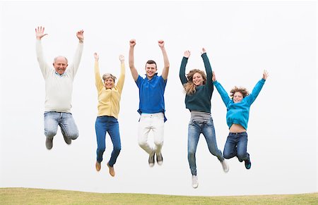 simsearch:400-07426233,k - Joyful family jumping together at the grass land Stock Photo - Budget Royalty-Free & Subscription, Code: 400-07426233