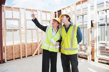 civil engineer and worker discussing issues at the construction site Stock Photo - Budget Royalty-Free & Subscription, Code: 400-07427601