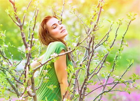 Portrait of seductive woman relaxing in the blooming garden, closed eyes, beauty of nature, fairy tale, spring time concept Stock Photo - Budget Royalty-Free & Subscription, Code: 400-07428829