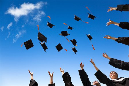 Students throwing graduation hats in the air celebrating Stock Photo - Budget Royalty-Free & Subscription, Code: 400-07429100