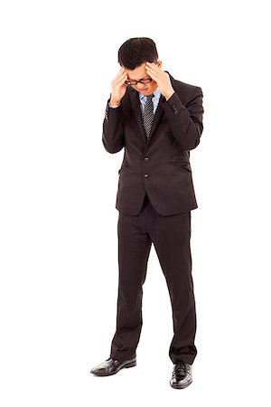 simsearch:400-04902701,k - businessman have a headache with painful expression Stock Photo - Budget Royalty-Free & Subscription, Code: 400-07429116