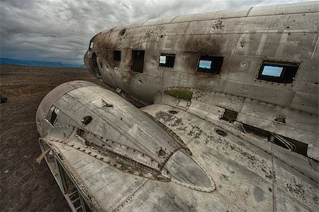 fuselage - Wreck of a US military plane crashed in the middle of the nowhere. The plane ran out of fuel and crashed in a desert not far from Vik, South Iceland in 1973. The crew survived. It is a famous site to visit nowadays, but hard to find. Stock Photo - Budget Royalty-Free & Subscription, Code: 400-07421205