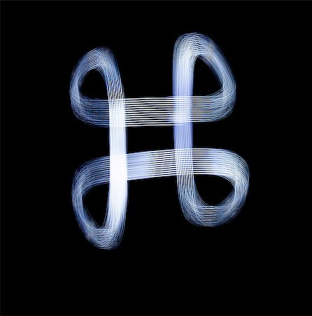 futuristic alphabets - Command Key Symbol Icon Using Light Painting Technique isolated over black Background Stock Photo - Budget Royalty-Free & Subscription, Code: 400-07421731
