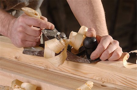 Man hands with carpenters plane on wooden background Stock Photo - Budget Royalty-Free & Subscription, Code: 400-07422954