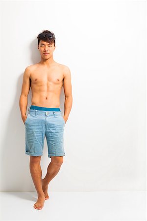 sexy young man standing and depend on wall Stock Photo - Budget Royalty-Free & Subscription, Code: 400-07431111