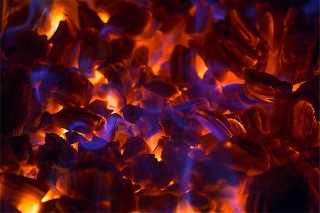 Hot glowing ember in a fireplace with beautiful blue flames Photographie de stock - Aubaine LD & Abonnement, Code: 400-07464071