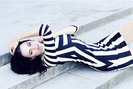 simsearch:400-04130120,k - attractive young woman in sexy dress outdoor lying stairs Stock Photo - Budget Royalty-Free & Subscription, Code: 400-07464886