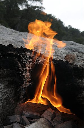 Yanartas (flaming rock) is generally believed to be the ancient Mount Chimaera ( Antalya, Turkey).  The fires are grouped over an area of 5000 m2 and are fueled by gas emissions which have been burning for at least 2500 years. Stock Photo - Budget Royalty-Free & Subscription, Code: 400-07466099