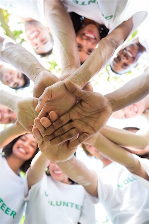 Low angle view of multiethnic environmentalists stacking hands Stock Photo - Budget Royalty-Free & Subscription, Code: 400-07467605