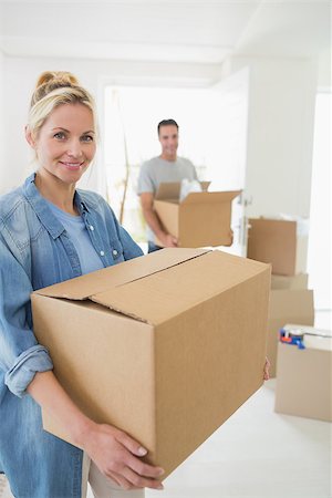 simsearch:400-07930718,k - Portrait of a smiling couple moving together in a new house Stock Photo - Budget Royalty-Free & Subscription, Code: 400-07467847
