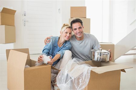 simsearch:400-07930718,k - Portrait of a smiling couple unpacking boxes in a new house Stock Photo - Budget Royalty-Free & Subscription, Code: 400-07467848