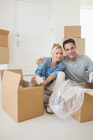 simsearch:400-07930718,k - Portrait of a smiling couple unpacking boxes in a new house Stock Photo - Budget Royalty-Free & Subscription, Code: 400-07467849