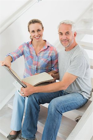 simsearch:400-07927836,k - Happy couple picking out carpet samples together in their new home Stock Photo - Budget Royalty-Free & Subscription, Code: 400-07476024