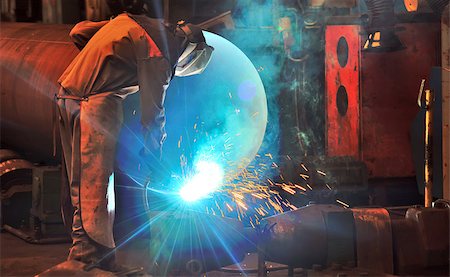 worker with protective mask welding metal Stock Photo - Budget Royalty-Free & Subscription, Code: 400-07477463