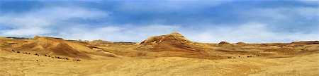 Beautiful landscape of the Judean Desert. Yellow and red hills and blue sky. Panorama. Stock Photo - Budget Royalty-Free & Subscription, Code: 400-07472599
