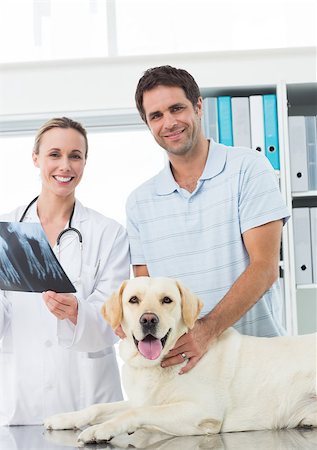 dog x-ray - Portrait of happy pet owner and vet with Xray of dog in hospital Stock Photo - Budget Royalty-Free & Subscription, Code: 400-07473607