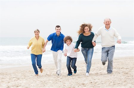 Happy family having fun in the beach vacation Stock Photo - Budget Royalty-Free & Subscription, Code: 400-07480708