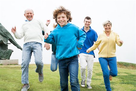 simsearch:400-07426233,k - Happy family having fun in the grass land Stock Photo - Budget Royalty-Free & Subscription, Code: 400-07480712