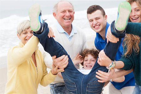 simsearch:400-07426233,k - Happy family with kid having fun at the beach Stock Photo - Budget Royalty-Free & Subscription, Code: 400-07480737