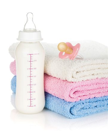 simsearch:400-06751007,k - Baby bottle, pacifier and towels. Isolated on white background Stock Photo - Budget Royalty-Free & Subscription, Code: 400-07481711