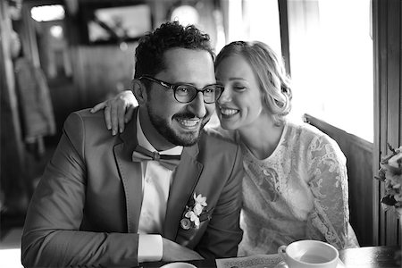 Happy newlywed couple in cafe. Groom and bride on wedding day. Stock Photo - Budget Royalty-Free & Subscription, Code: 400-07481983