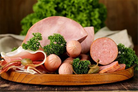simsearch:400-06207145,k - various kinds of sausages and smoked bacon on the wooden plate Stock Photo - Budget Royalty-Free & Subscription, Code: 400-07482643