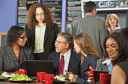 simsearch:400-04099373,k - Four business people meeting with laptop on lunch table Stock Photo - Budget Royalty-Free & Subscription, Code: 400-07507038