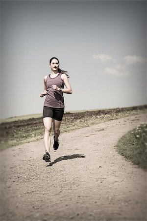 sumners (artist) - Photo of a beautiful young woman running down a gravel road. Stock Photo - Budget Royalty-Free & Subscription, Code: 400-07509637