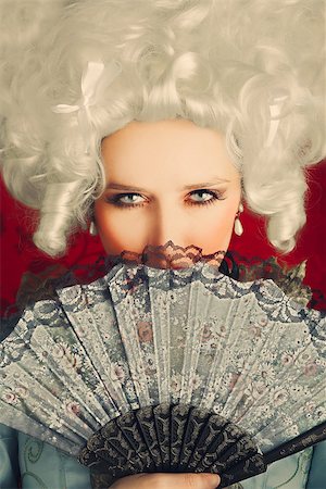 Baroque style portrait of a young beautiful woman behind a hand fan Stock Photo - Budget Royalty-Free & Subscription, Code: 400-07502464