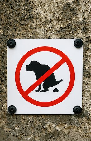 defecation - No Dog Pooping fouling sign isolated on wall background Stock Photo - Budget Royalty-Free & Subscription, Code: 400-07502873